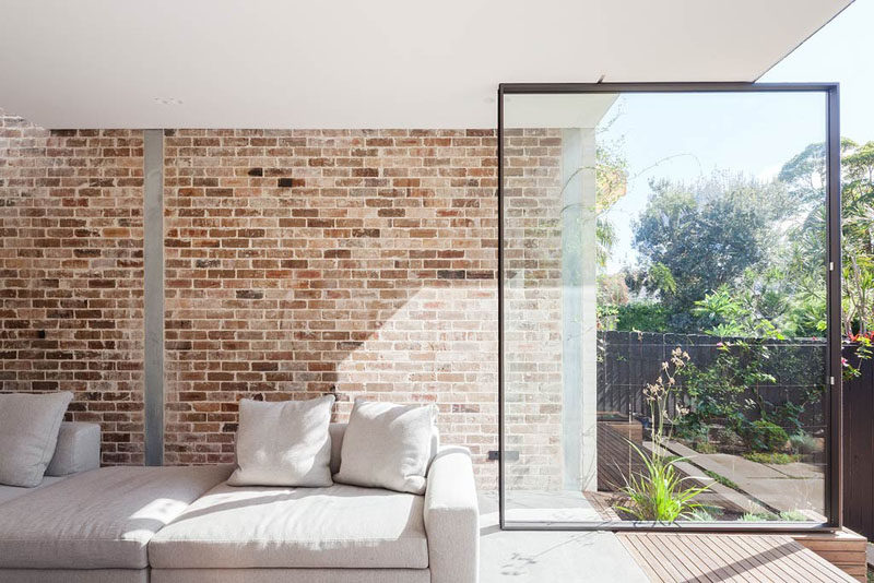 The Back Wall Of This Home Is Made From Two Large Pivoting Glass Doors