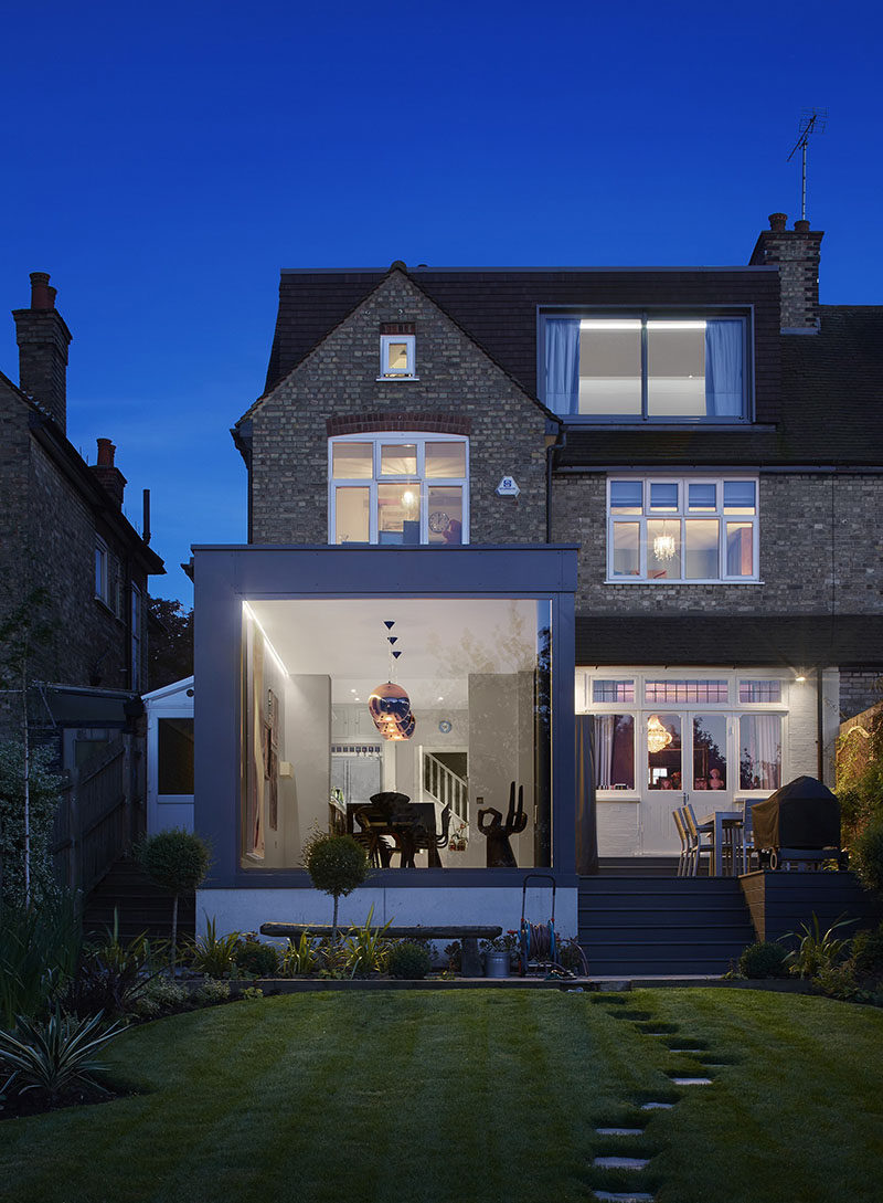 A glass enclosed extension created a dining room with views for this home