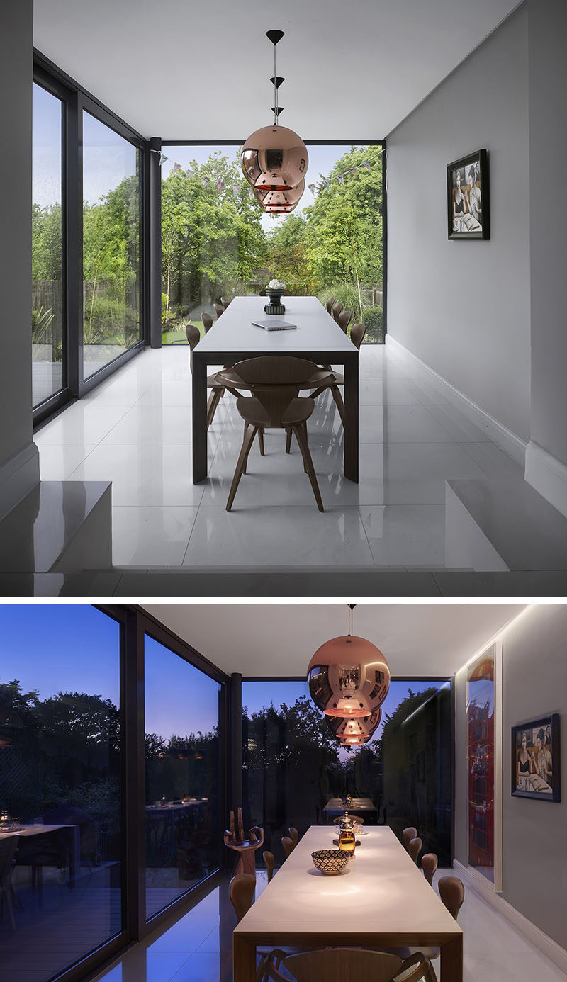 This dining room is surrounded by floor-to-ceiling windows.