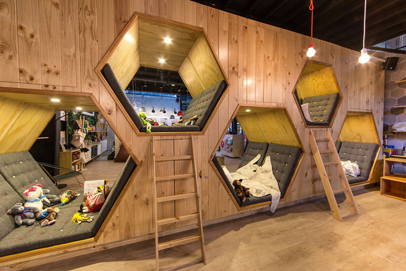 19 Ideas For Using Hexagons In Interior Design And Architecture // The 9 3/4 Bookstore + Cafe has hexagon shaped hideaway spaces for extra cozy reading.