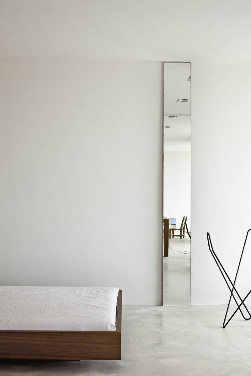 11 Ideas For Making Your Room Feel Taller // Long Mirrors -- As they reflect a lot of light, mirrors are a great way to make any space feel larger. And, if they're positioned vertically, they make the space feel taller by drawing the eye upward.