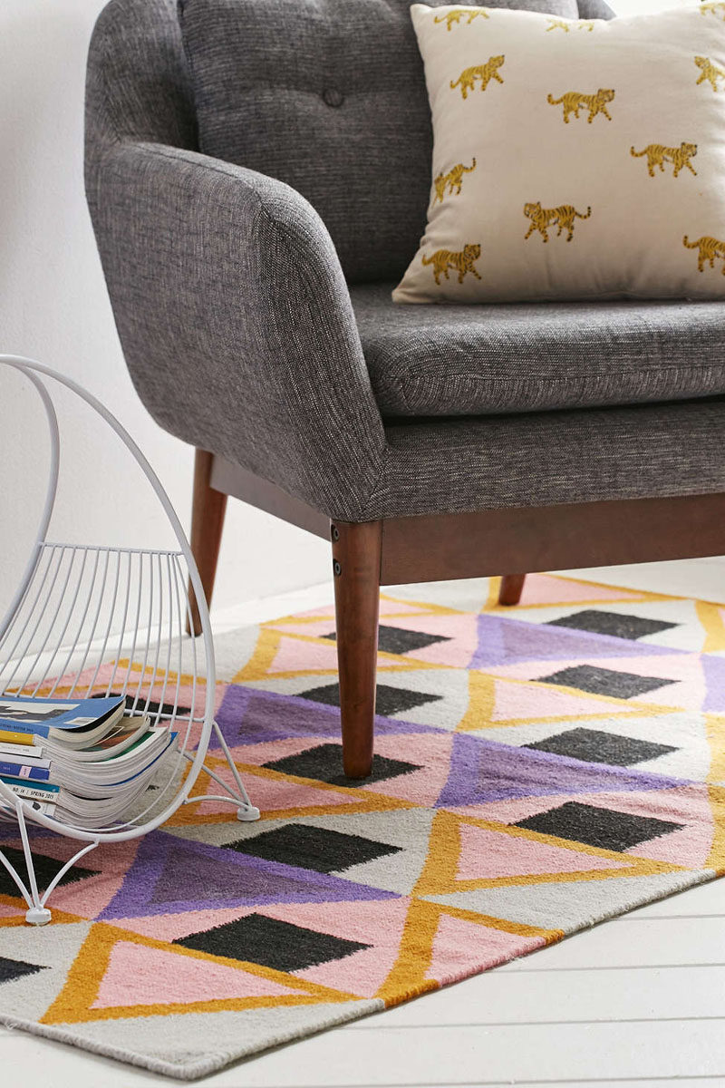 11 Ideas For Making Your Room Feel Taller // Be Bold -- Bold floor rugs will keep the focus at ground level and distract from the height of the ceiling, making the space feel taller.