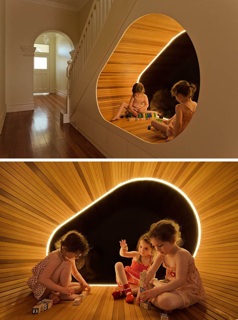 11 Kids Only Hideouts That Even The Biggest Grownups Would Be Jealous Of // The extra space under the stairs in this family home has been converted into a play area complete with tube lighting and a wood finish.