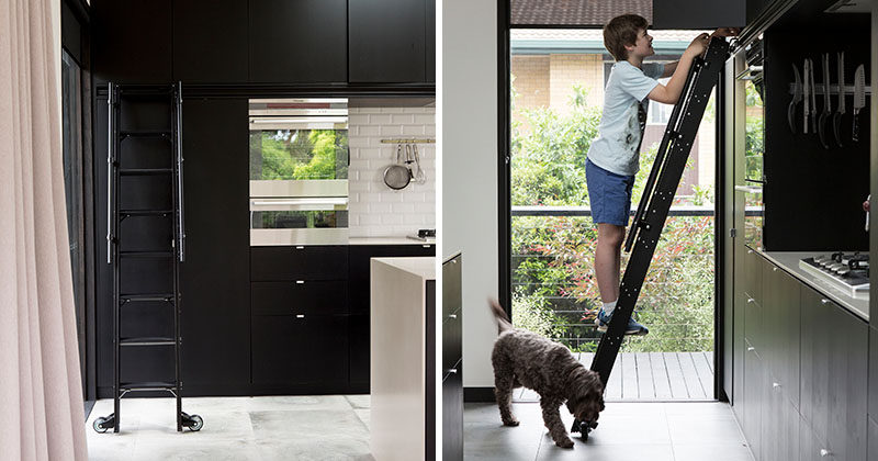 This Matte Black Kitchen Has A Rolling Ladder To Reach The Upper Cabinets