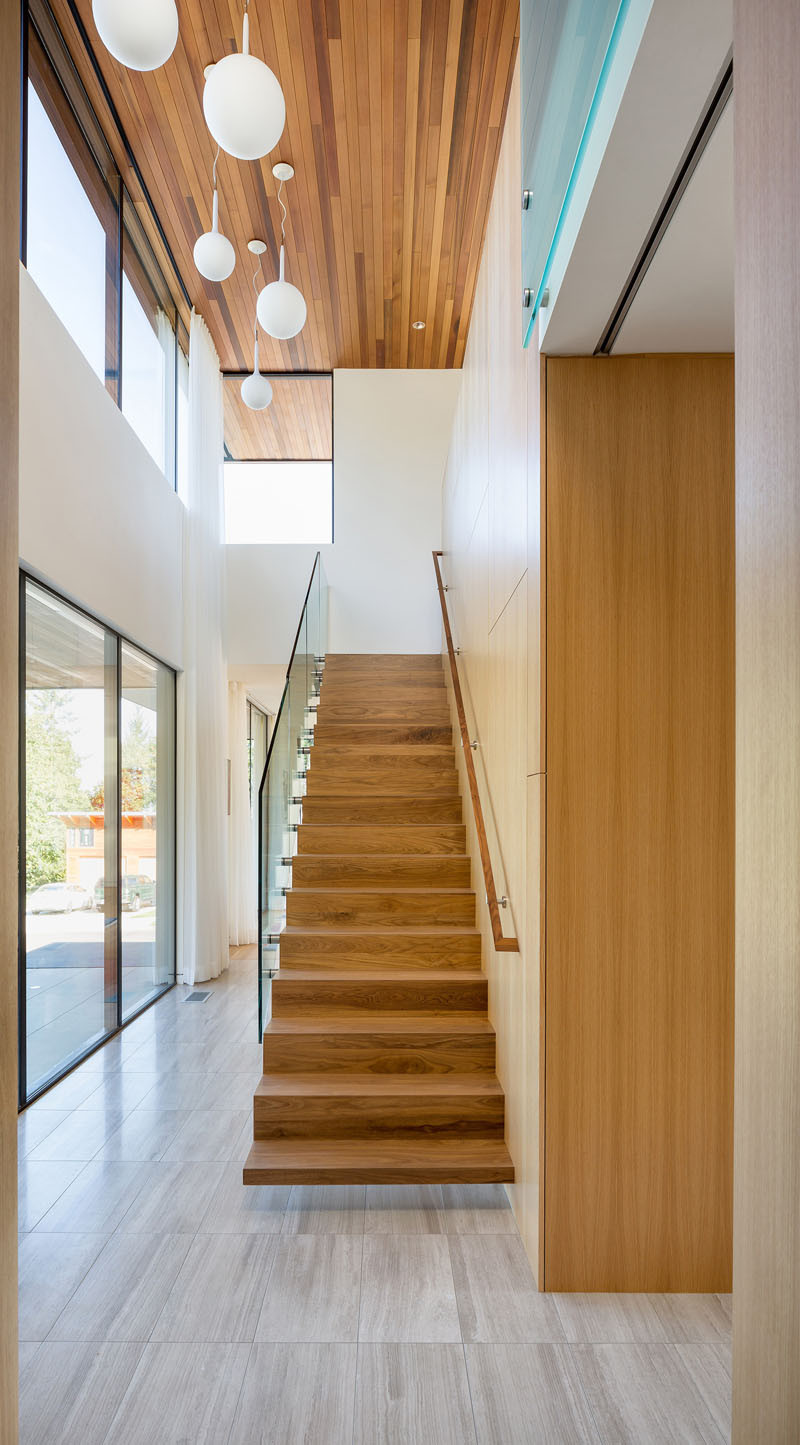 Leading you up to the roof terrace of this home, are cantilevered walnut stairs.