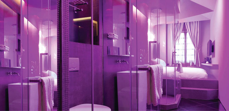 10 Examples Of Monochromatic Interiors // The Wanderlust hotel in Singapore has a series of rooms inspired by Pantone colors, like this purple hotel suite.