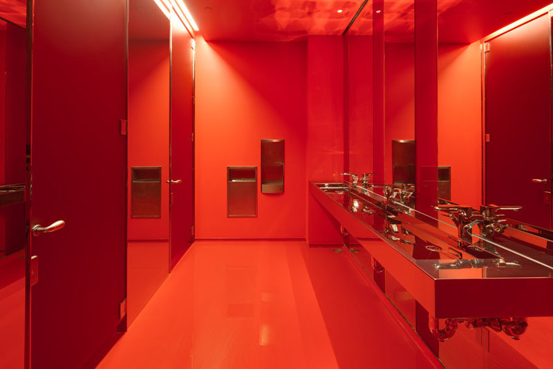 10 Examples Of Monochromatic Interiors // In keeping with their name, Red Bull's bathroom in their New York Music school is bright red.