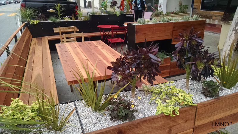 This modern wood and steel parklet outside a bakery in San Francisco, is surrounded by herbs and succulents, and was designed to increase the foot traffic outside their location and at the same enhance the street.