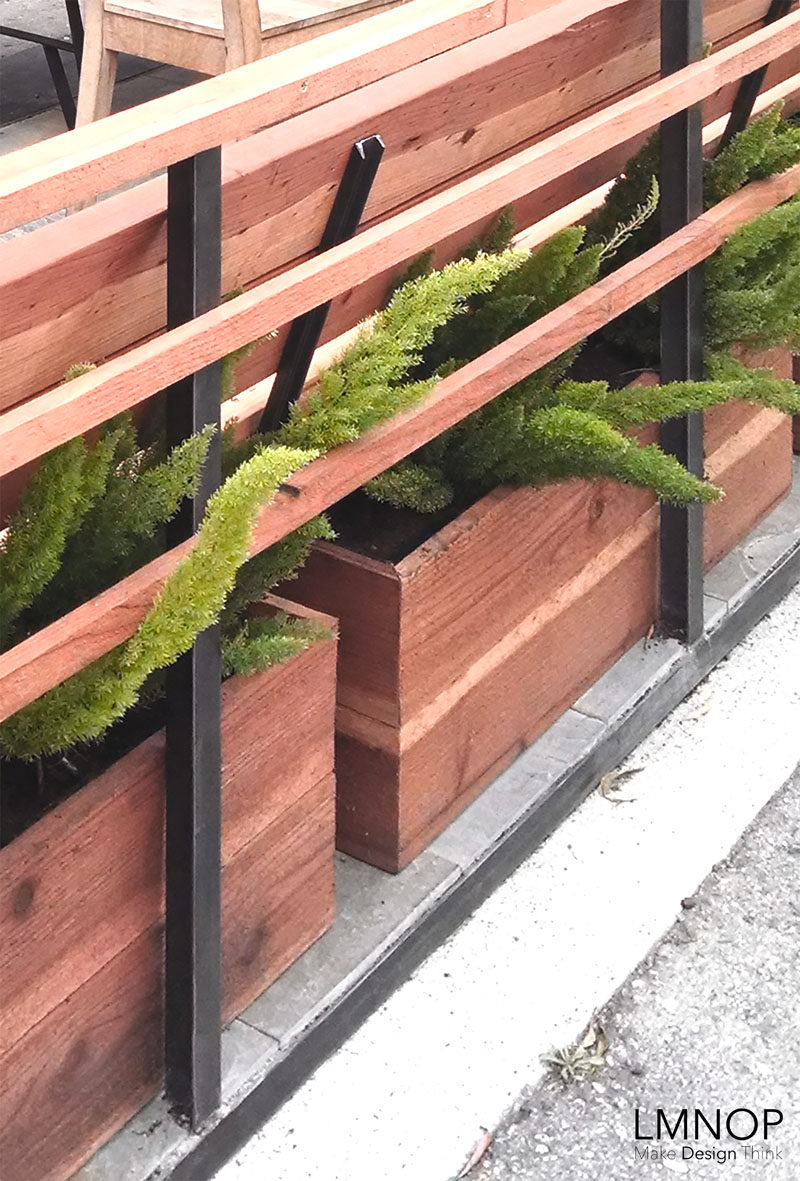 This modern wood and steel parklet outside a bakery in San Francisco, is surrounded by herbs and succulents, and was designed to increase the foot traffic outside their location and at the same enhance the street.