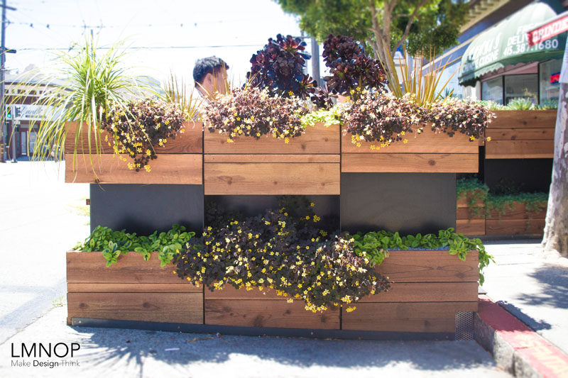 This modern wood and steel parklet outside a bakery in San Francisco, is surrounded by herbs and succulents, and was designed to increase the foot traffic outside their location and at the same enhance the street.