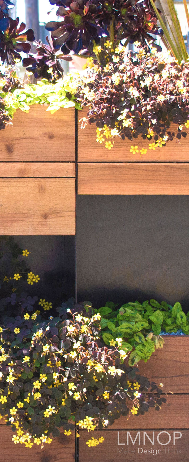 This modern wood and steel parklet outside a bakery in San Francisco, is surrounded by herbs and succulents, and was designed to increase the foot traffic outside their location and at the same enhance the street.