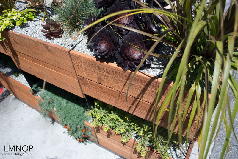 This modern wood and steel parklet outside a bakery in San Francisco, is surrounded by herbs and succulents, and was designed to increase the foot traffic outside their location and at the same enhance the street.