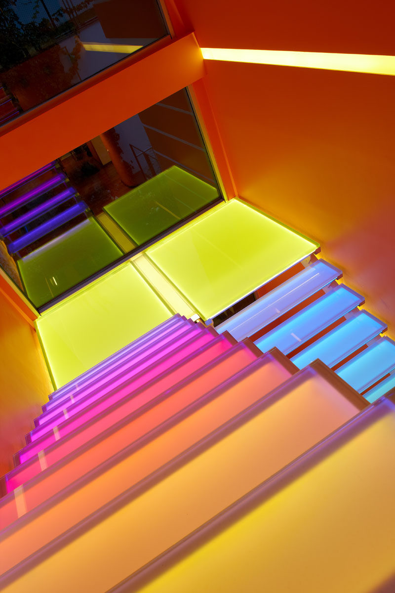 7 Inspiring Examples Of Rainbow Stairs // These stairs have hidden lighting so they can be lit up in a rainbow of colors