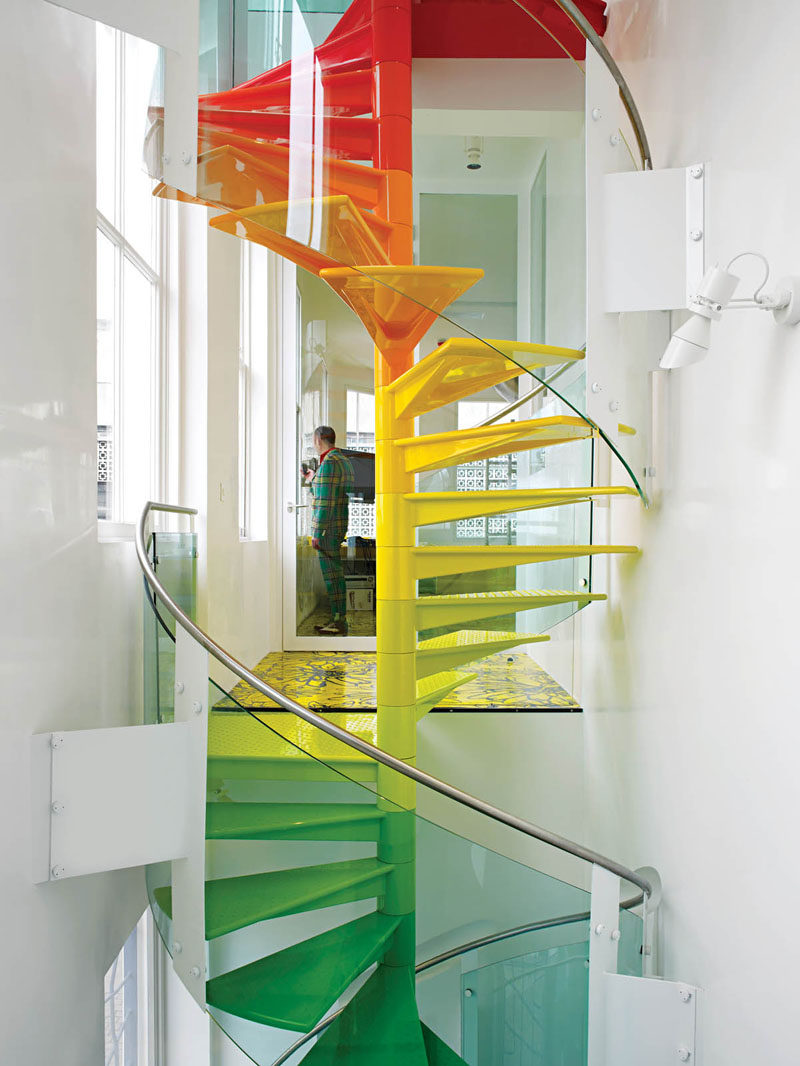 7 Inspiring Examples Of Rainbow Stairs // These rainbow spiral stairs add some color to this London home.