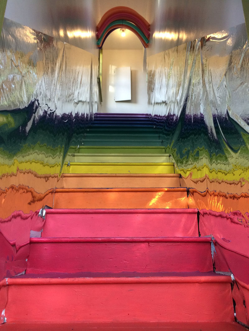 7 Inspiring Examples Of Rainbow Stairs // The walls of this rainbow staircase are lined with foil making the rainbow reflect back and forth.