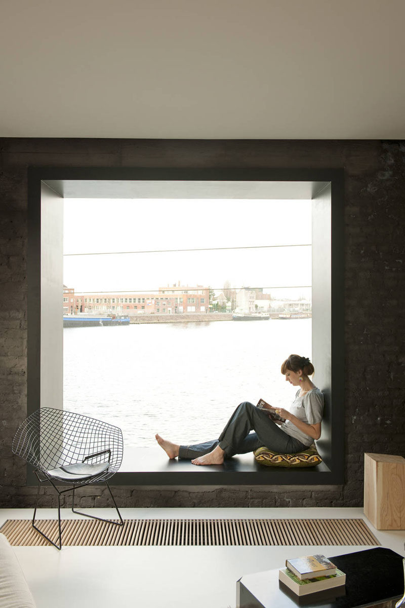 10 Reading Nooks Perfect For Curling Up In // This window seat is a great place to sit and read, or watch the boats go by outside.