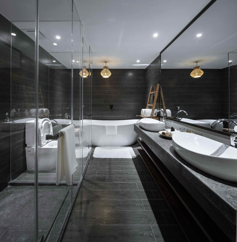 23 Pictures Of The Ripple Hotel At Qiandao Lake, In Hangzhou, China // Luxurious dark gray and white bathroom suite.