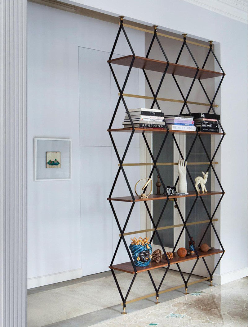 15 Creative Ideas For Room Dividers // This multi-functional design is both a floor-to-ceiling shelf and a room divider.