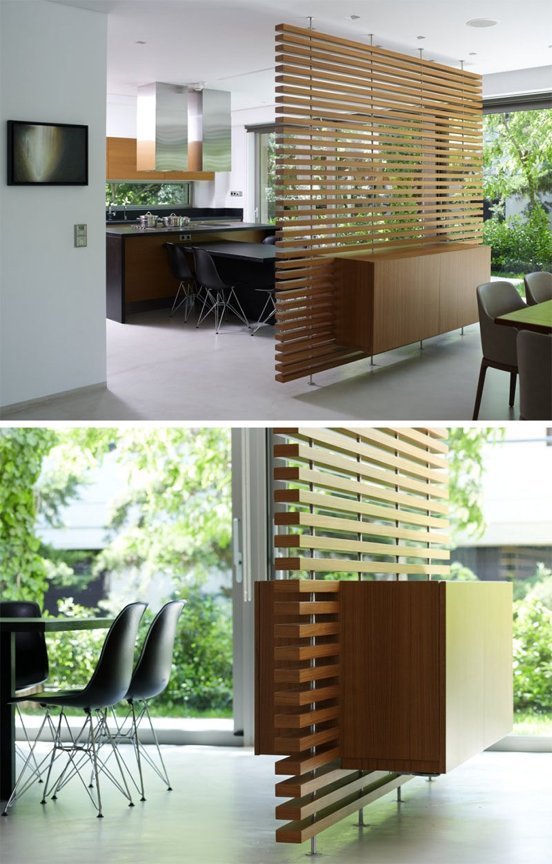 15 Creative Ideas For Room Dividers // This slatted wooden room divider has a built-in cabinet. #ModernRoomDivider #RoomDivider #InteriorDesign #Interiors