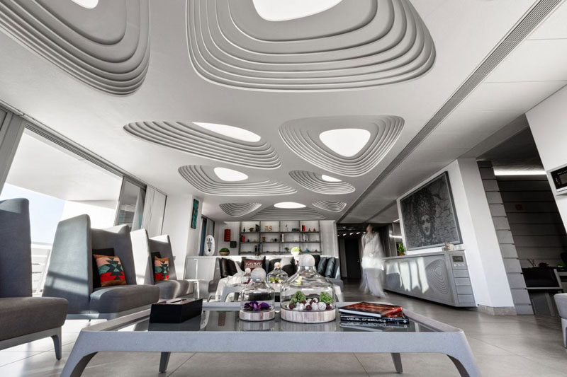 13 Amazing Examples Of Creative Sculptural Ceilings // The futuristic feel of this penthouse is accentuated by the design of the ceiling.