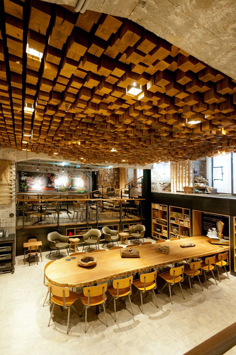 13 Amazing Examples Of Creative Sculptural Ceilings // This Starbucks ceiling in Amsterdam is made of 1,876 pieces of individually cut blocks of Dutch oak.