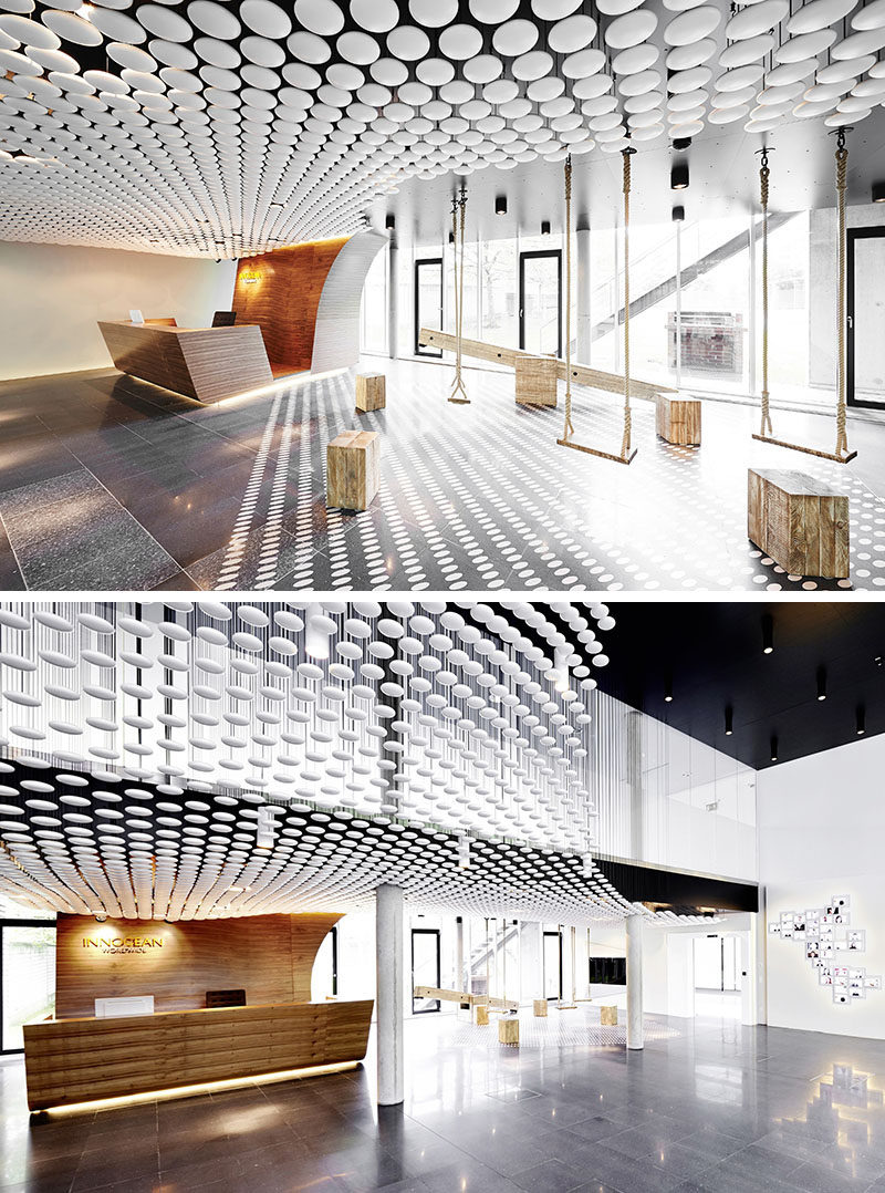 13 Amazing Examples Of Creative Sculptural Ceilings // The entry way of the INNOCEAN Headquarters is filled with white circles.