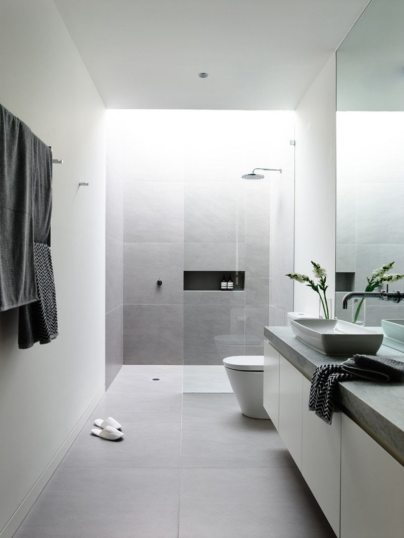 12 Ideas For Including Built-In Shelving In Your Shower // A long built-in shelving compartment in this shower, is a great place to store shower gels, shampoos, and conditioners.