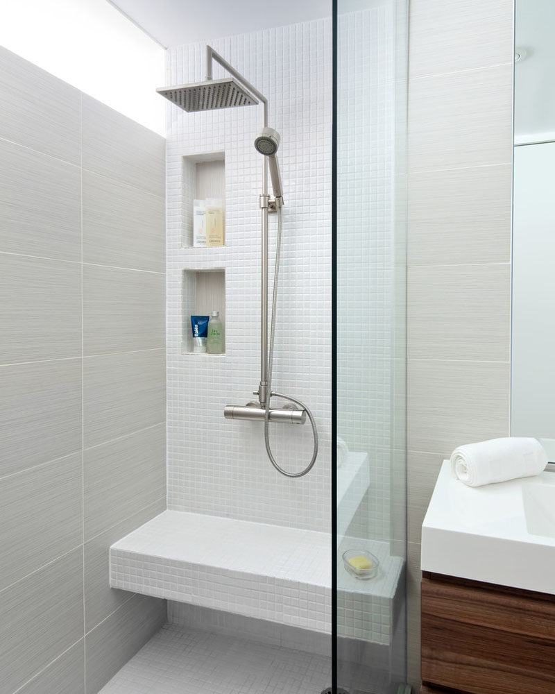 12 Ideas For Including Built-In Shelving In Your Shower // This shower has two tall built-in shelves and a bench that could also be used for extra storage if necessary.