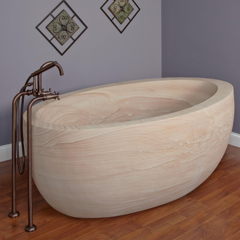 8 Stunning Examples Of Stone Bathtubs // This bathtub is handcrafted from a solid block of natural sandstone making every one unique.