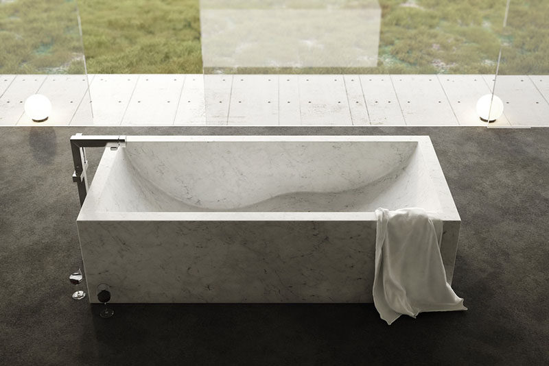 8 Stunning Examples Of Stone Bathtubs // The Onda Bathtub from The Vero Stone, is hand chiseled from Italian natural stone.