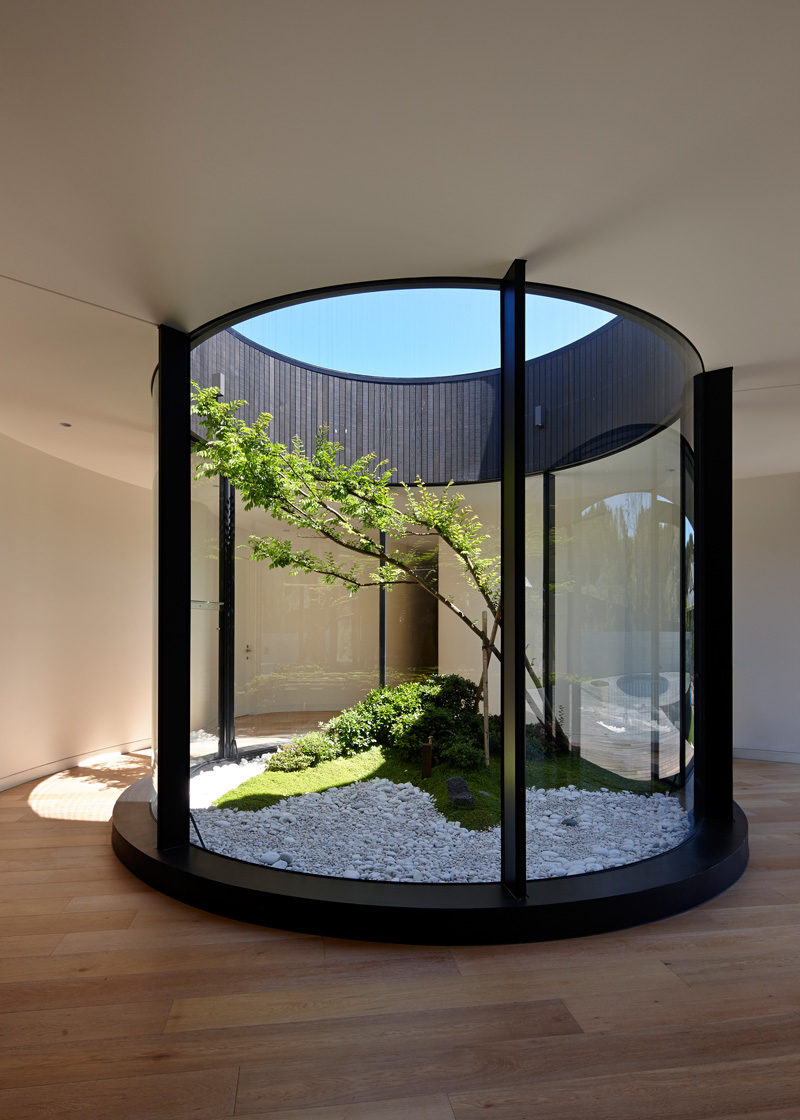 This Atrium Adds Nature And Light Inside This Home