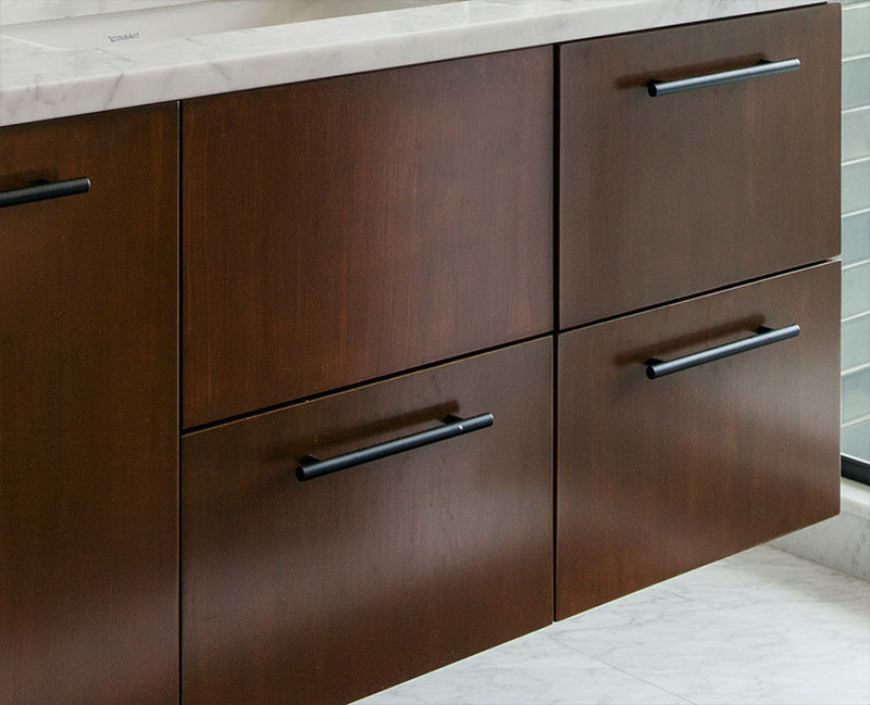 Bathroom Idea - dark wood vanity with white marble counter and matte black hardware.