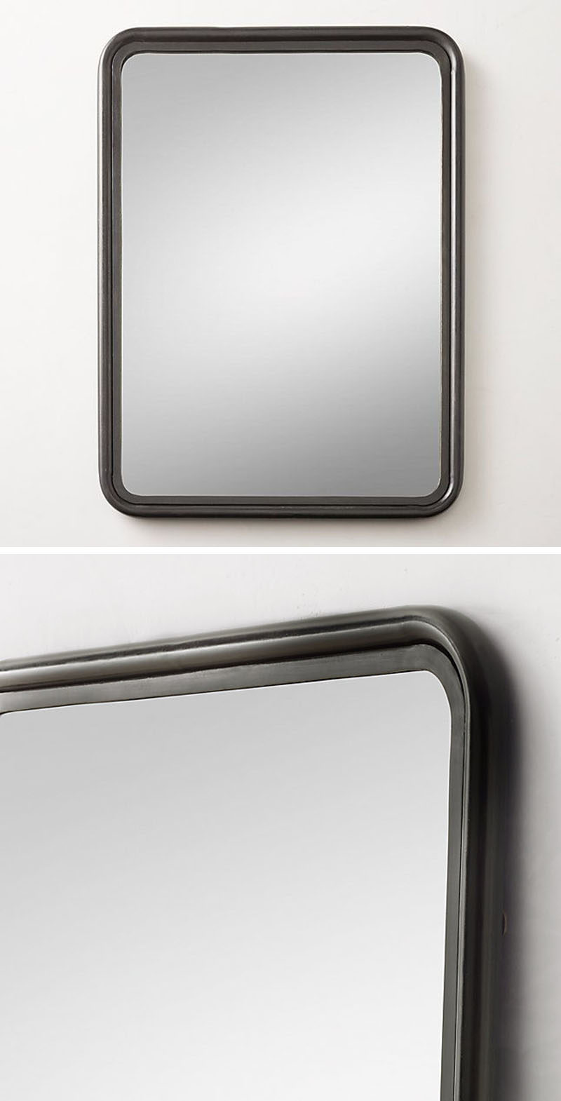 A black framed mirror with rounded edges