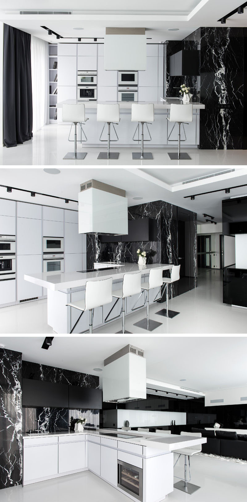 In this black and white apartment, the kitchen is mostly white, with a natural black marble and black curtains used to continue the black and white theme.