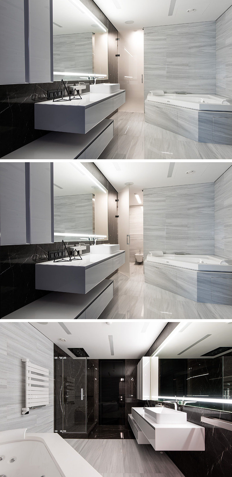 In this black and white bathroom, a lighter stone tile has been used around the bath and on the floor, and a frosted glass door separates the toilet from the main bathroom. Opposite the bath and toilet is the shower, which uses darker marble as a shower surround.