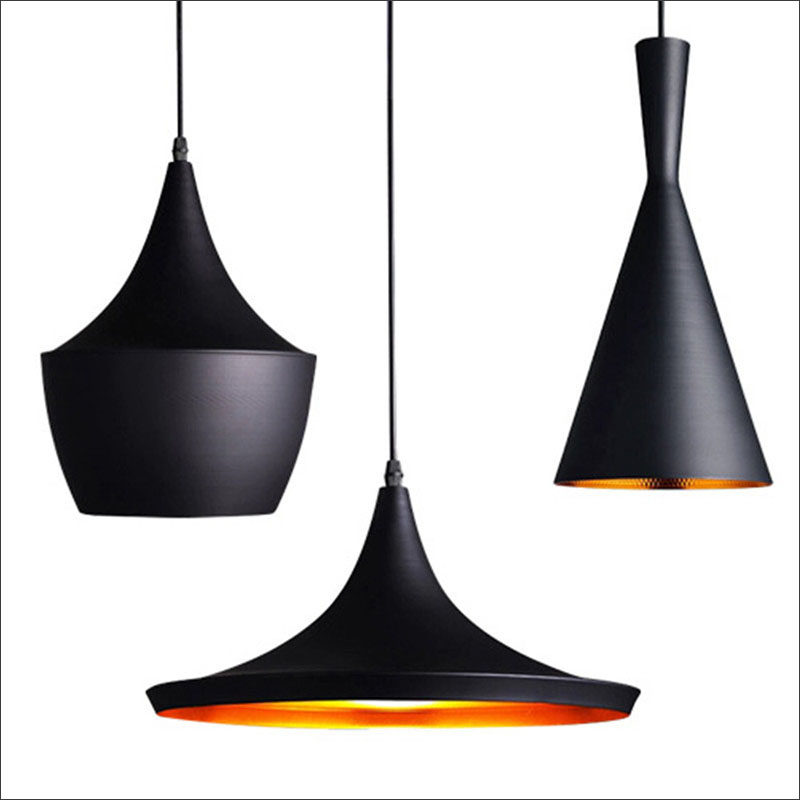 Hang black pendant lights above your kitchen island for a dramatic effect without the commitment of all black everything. #BlackLighting #BlackPendantLights