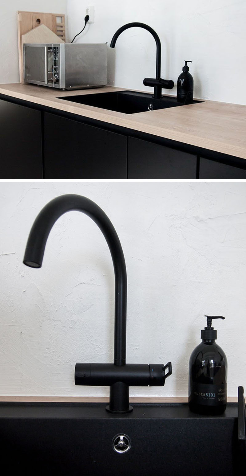 A black sink and matching faucet can tie together all the other elements of black and make for a cohesive, edgy look. #BlackKitchen #BlackSink #BlackFaucet