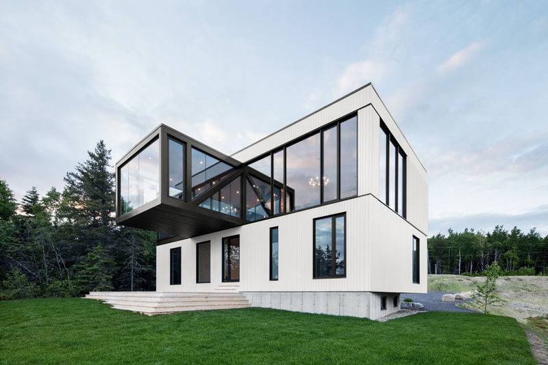 Perched overlooking the coastline of Charlevoix, Quebec, is this contemporary home that has a cantilevered living room.