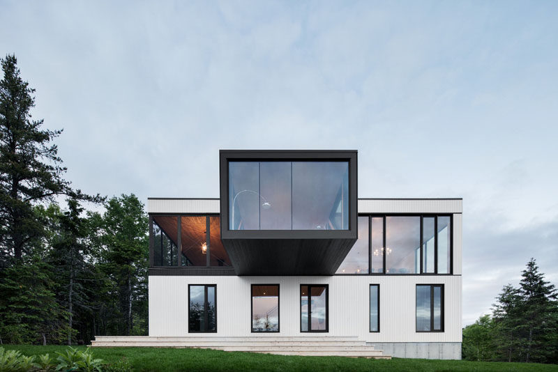 Perched overlooking the coastline of Charlevoix, Quebec, is this contemporary home that has a cantilevered living room.