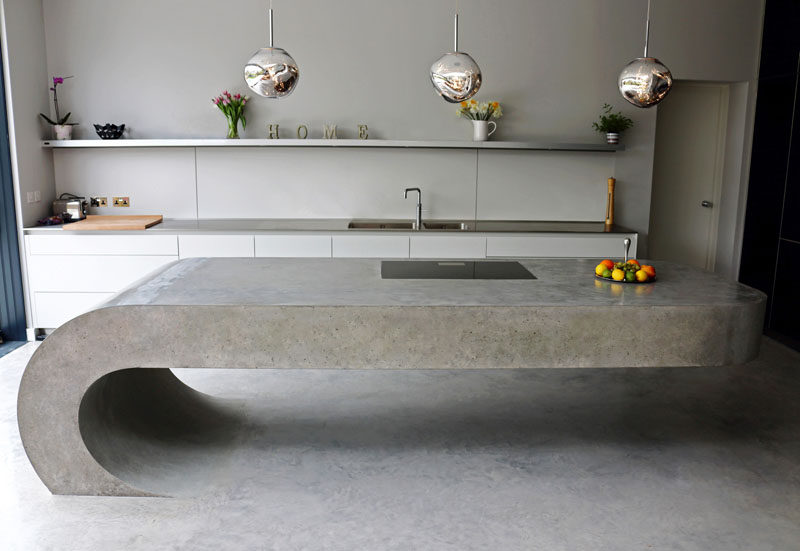 This cantilevered kitchen island is made from concrete.