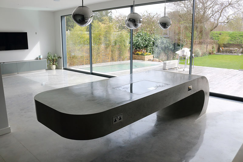 This cantilevered kitchen island is made from concrete.