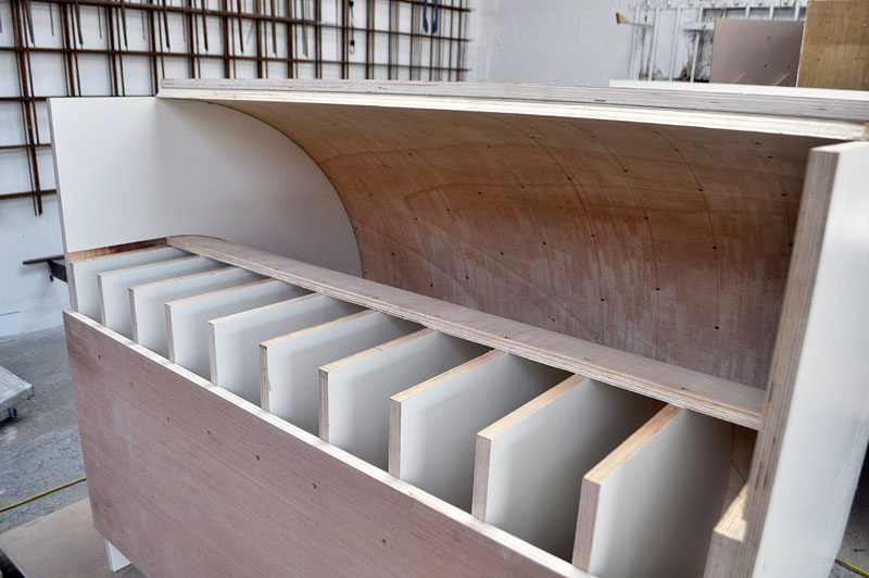 This cantilevered kitchen island is made from concrete.