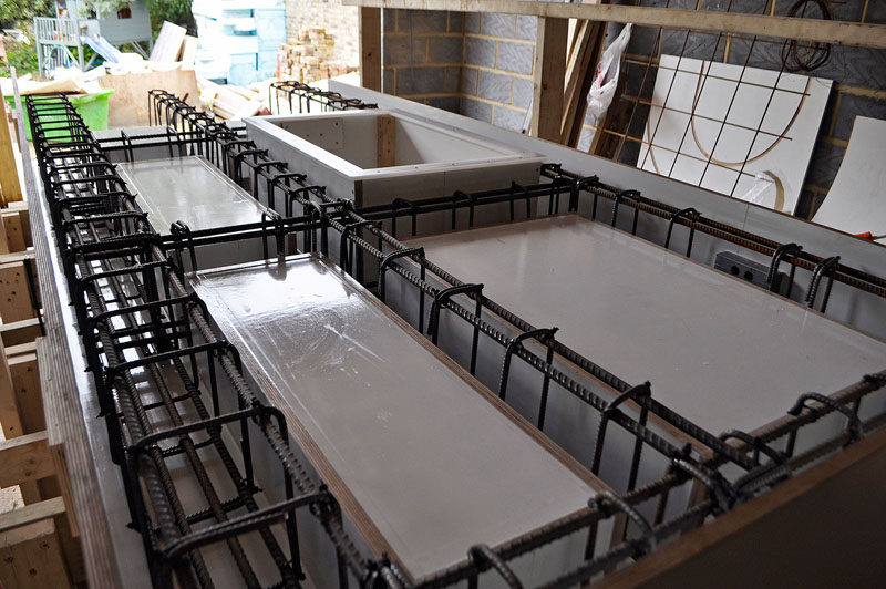 This cantilevered kitchen island is made from concrete.