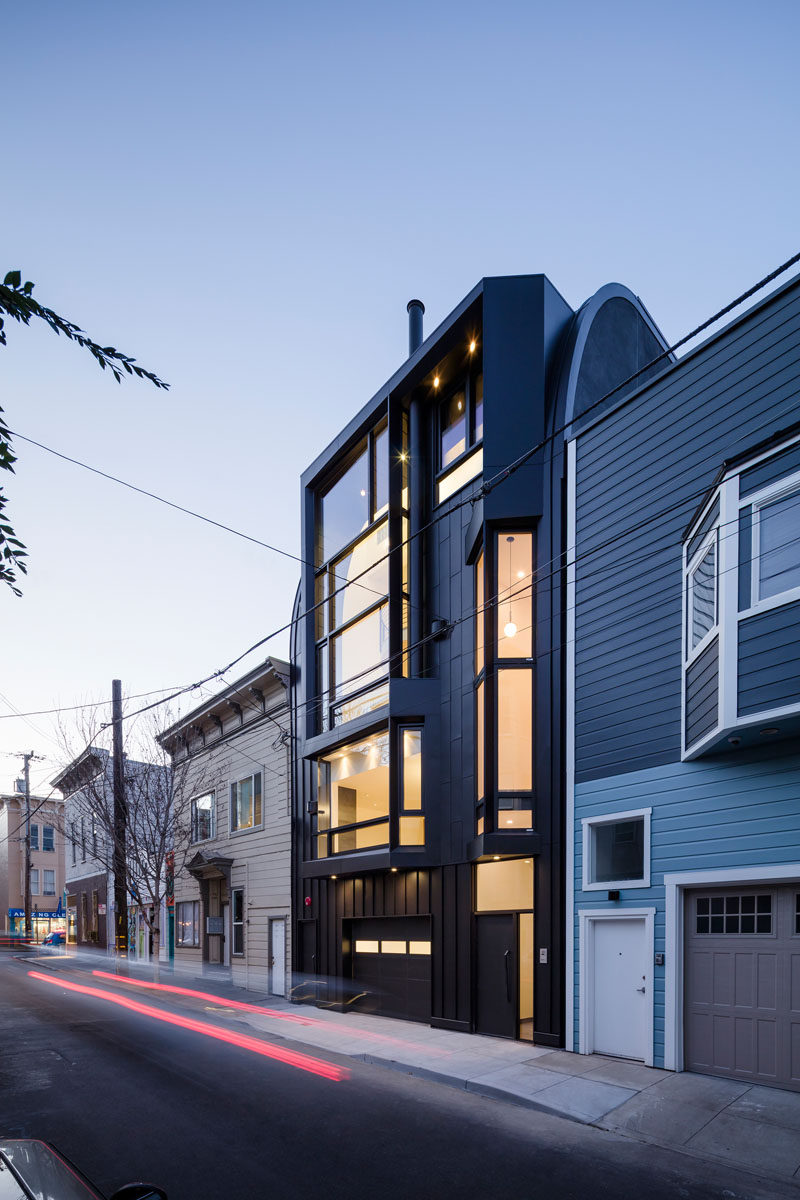 Designed by Stephen Phillips Architects, this black apartment building in San Francisco, is in a mixed-use commercial and residential district, that incorporates an eclectic group of traditional one- to four-story Victorian and Edwardian houses.