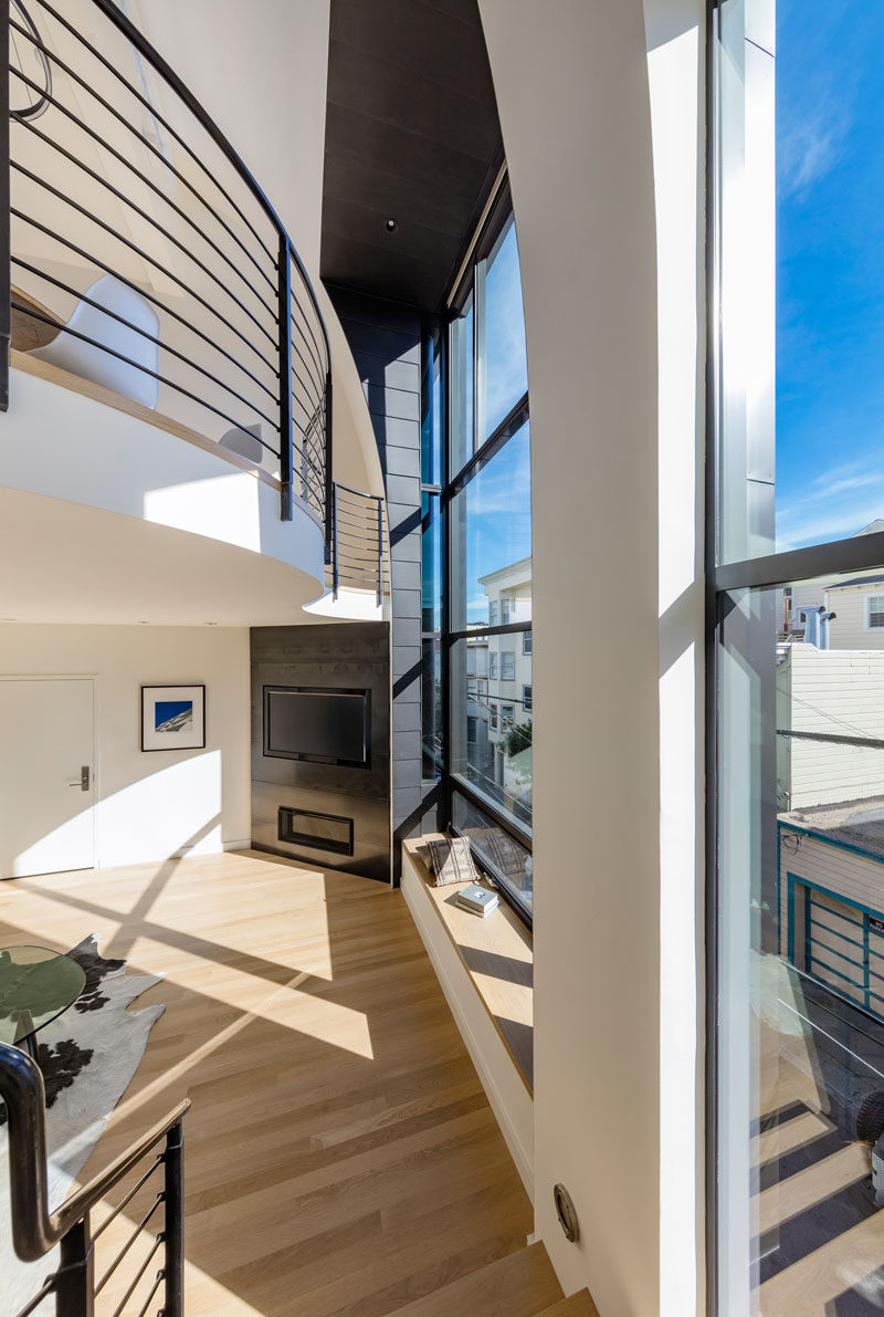 The fireplace and tv are built into the corner of the room in this apartment.