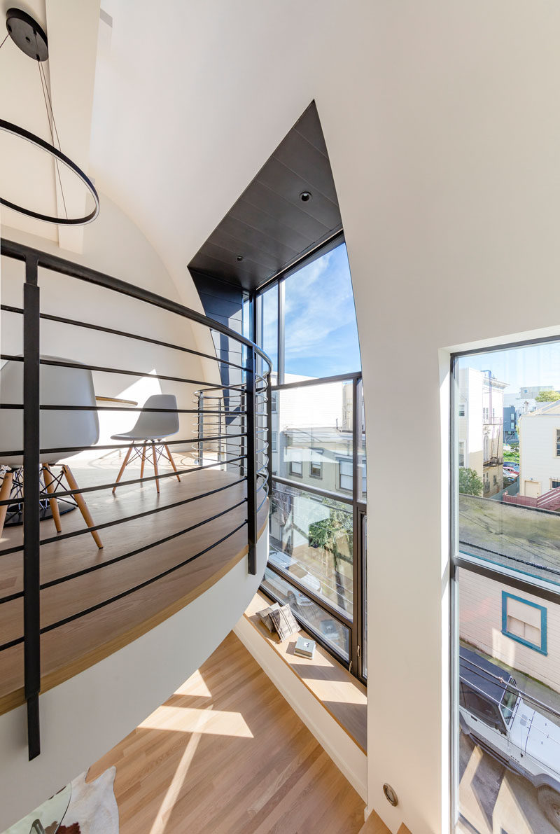 This mezzanine level has black railings to match the black window frames.