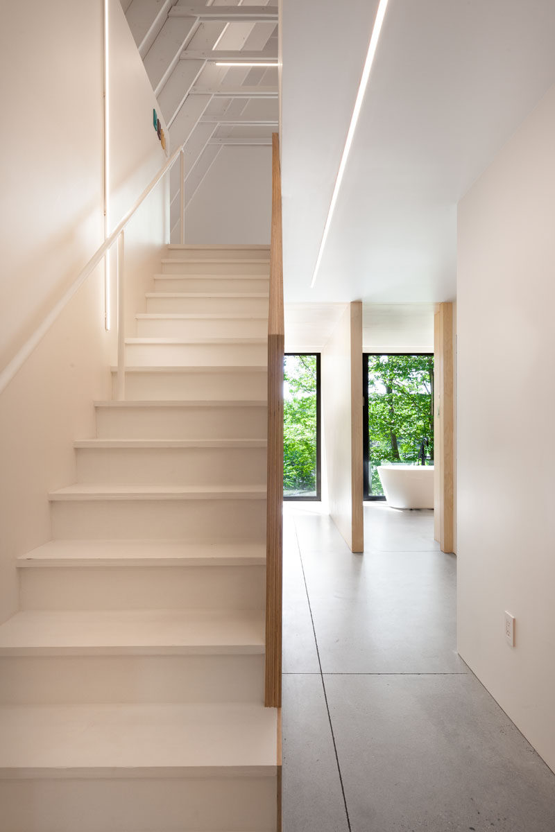 These white stairs lead to an attic play space.