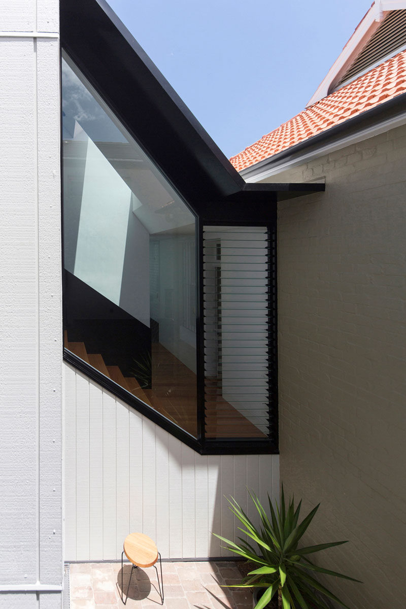 The angle of the windows perfectly match the angle of the stairs on the inside of the home.