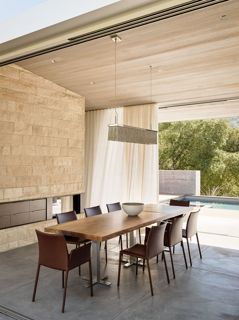 This dining room opens on both sides to provide access to outdoor entertaining areas.