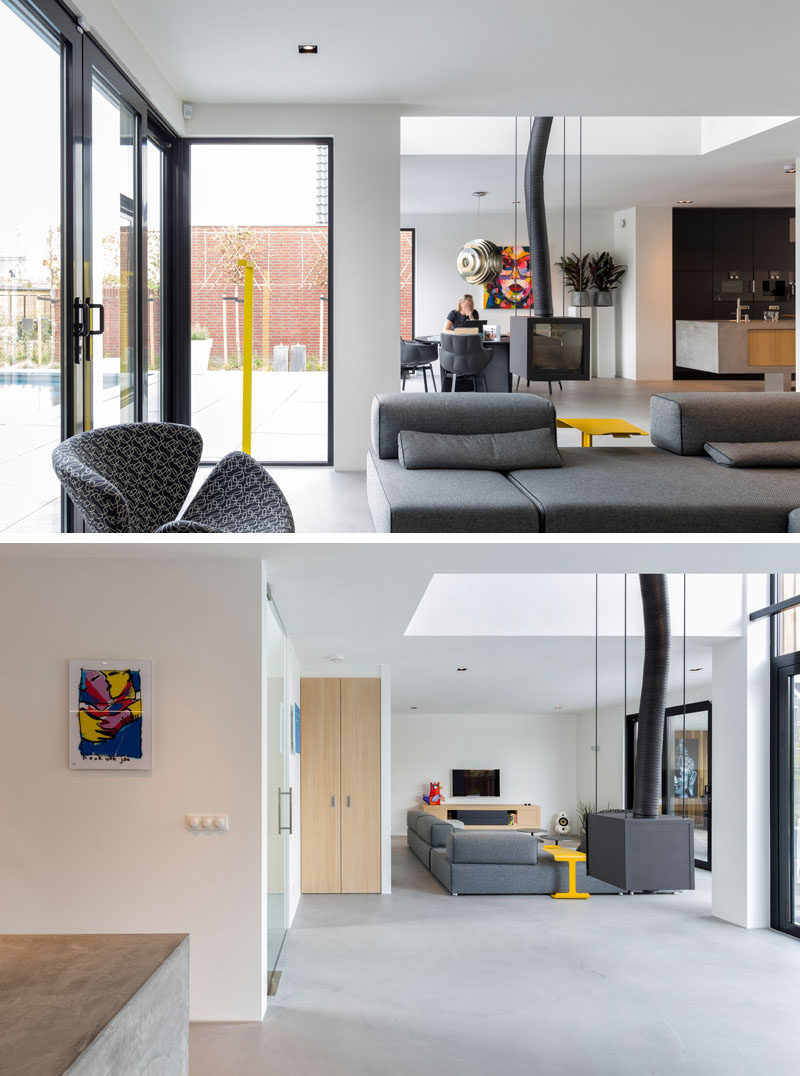 Inside this home, the dining room, kitchen and living area all share the same space, which has access to the backyard. An interesting feature of this space is the hanging fireplace.